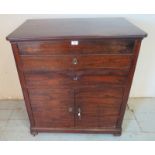 A 19th century continental mahogany campaign washstand, the hinged lid revealing a marble topped