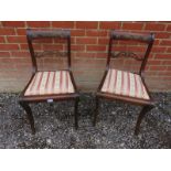 A pair of Regency mahogany framed occasional chairs with applied metal mounts and