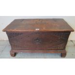 A small antique oak metal bound coffer/blanket box with relief carving to lid depicting a ship at