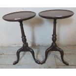 A pair of diminutive Edwardian mahogany wine tables with dished tops, baluster columns and tripod