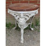 A 19th century cast iron 'Britannia' pub table, painted white with replacement oak top. 69cm high
