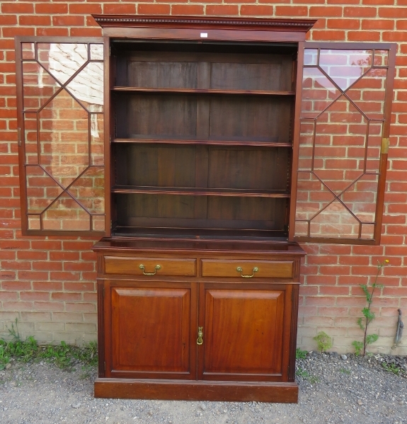 An Edwardian mahogany tall bookcase with dentil cornice over astral glazed doors opening onto - Image 3 of 4