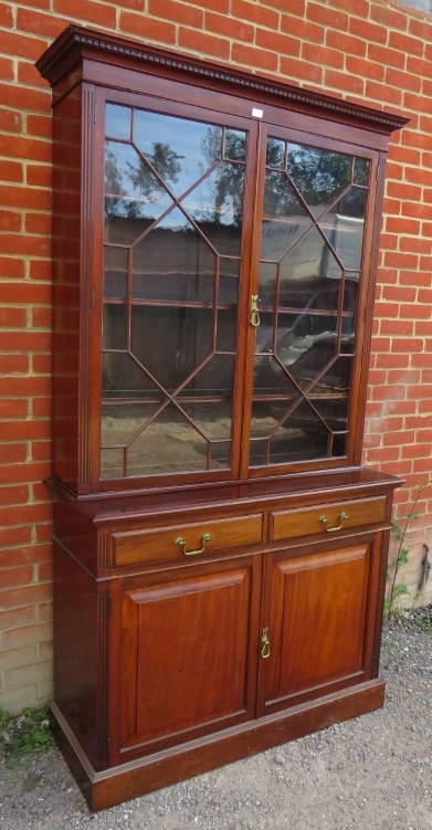 An Edwardian mahogany tall bookcase with dentil cornice over astral glazed doors opening onto - Image 2 of 4