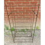 A vintage wrought iron wine rack with aged patina. 104cm high x 54cm wide x 45cm deep (approx).
