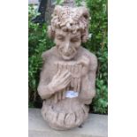 A terracotta garden ornament in the style of Pan. 33cm high x 18cm wide x 16cm deep (approx).
