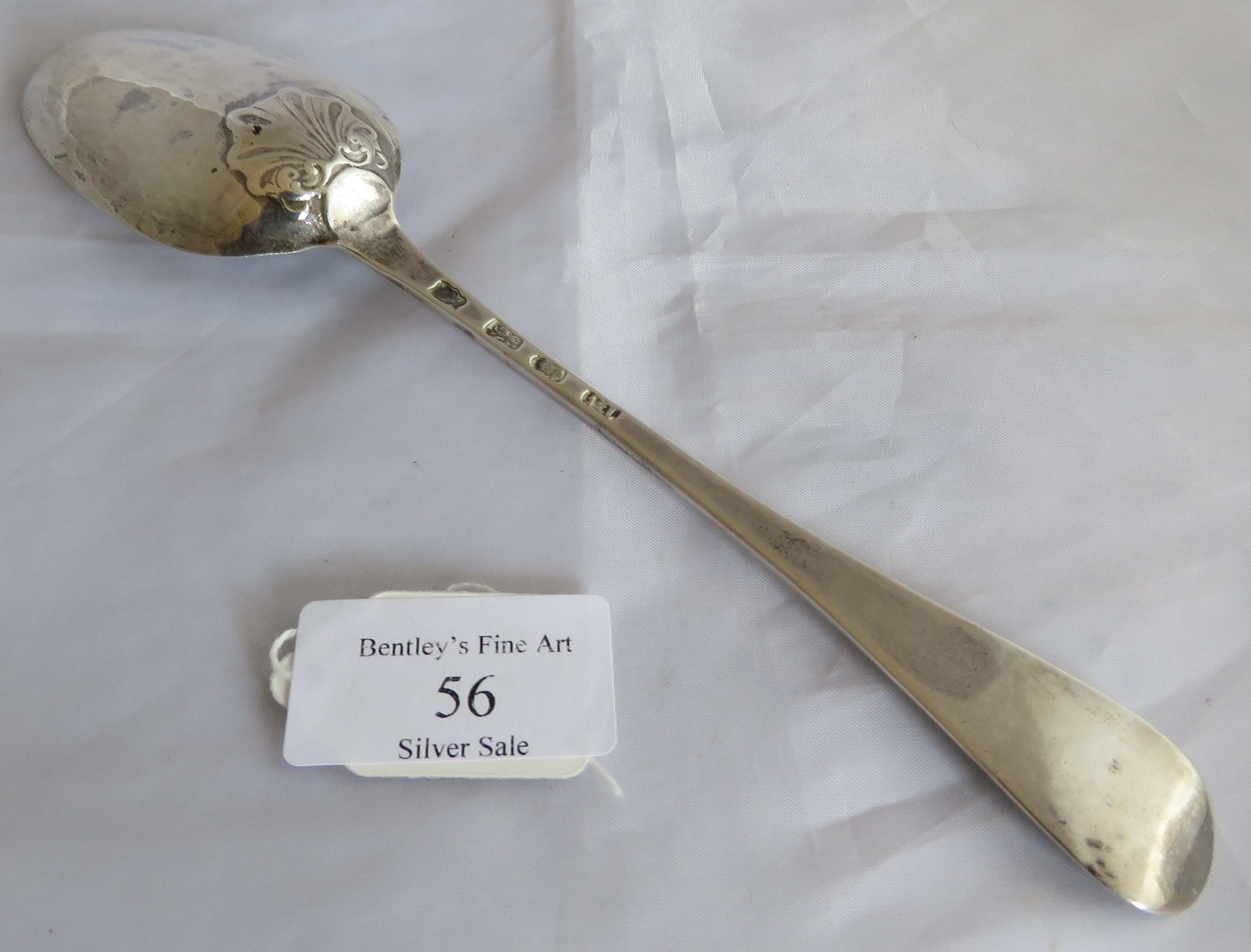 A silver George III tablespoon with shell to back of bowl. London 1767, maker WT. Weight 57 grams, - Image 2 of 4