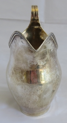 A Georgian silver helmet shaped cream jug with reeded pattern to handle and rim. London 1803, makers - Image 3 of 6