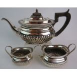 A late Victorian Georgian-revival silver three piece tea set by Mappin Brothers, 66 Cheapside &