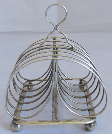 A large Georgian silver toast rack on ball feet, Sheffield 1824, maker John and Thomas Settle. - Image 2 of 4