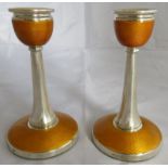 A good pair of silver and yellow enamel candlesticks. Birmingham 1930, maker Adie Borthers Ltd.