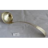 An Irish silver large Georgian oar handle shaped soup ladle with vase motif to end of handle, Dublin