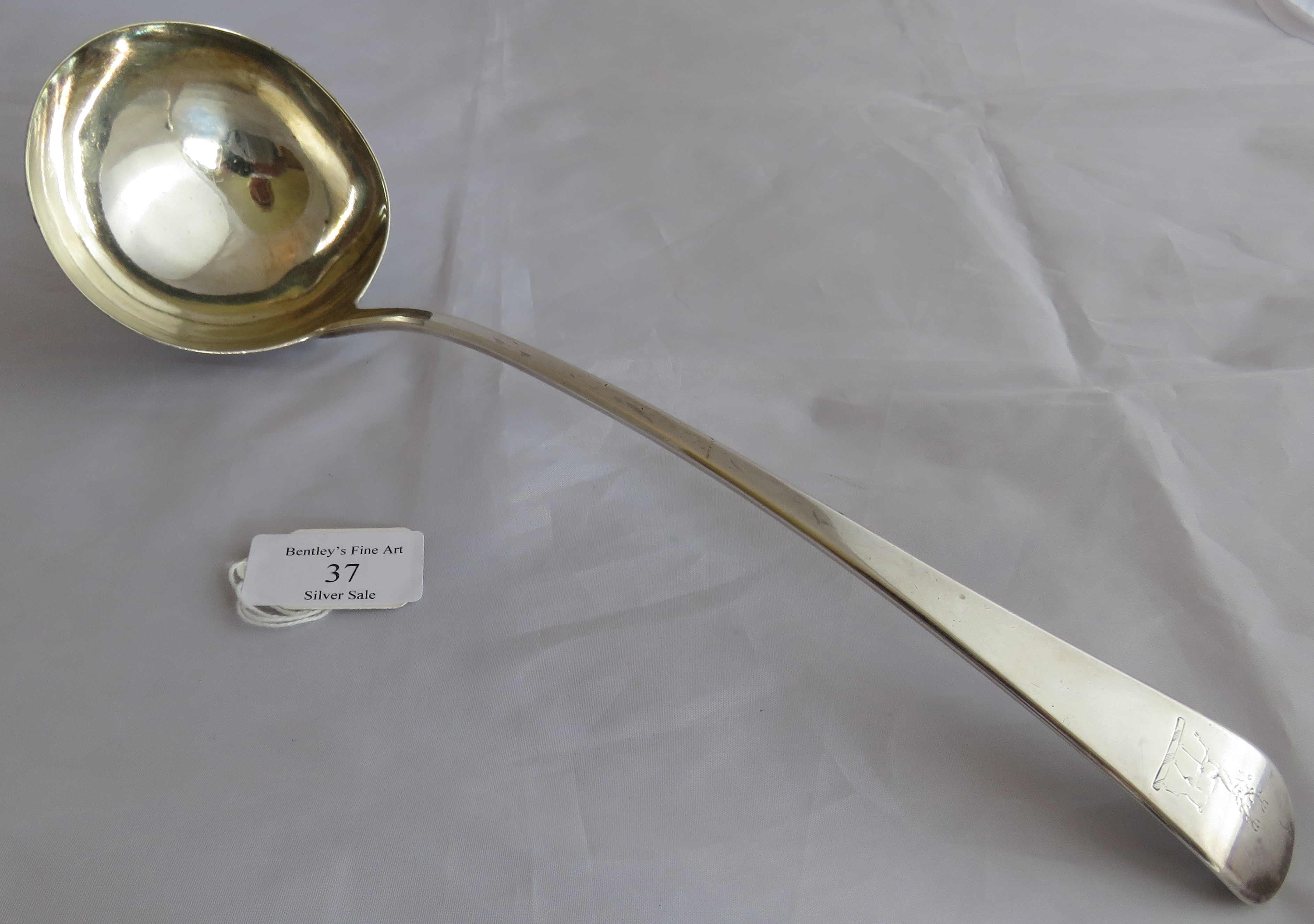 A large silver C18th Georgian soup ladle, London 1796, maker Richard Crossley. Heraldic mark to