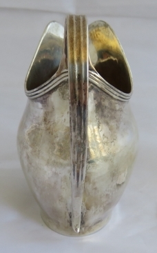 A Georgian silver helmet shaped cream jug with reeded pattern to handle and rim. London 1803, makers - Image 4 of 6