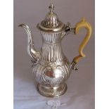 A Georgian Newcastle silver coffee pot with bone handle with fluted body and floral and foliate