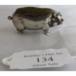 A small silver pig pin cushion. Birmingham 1906, maker's mark rubbed. Measures 2 inches long nose to