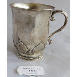 A silver christening mug with stylised tulip raised base. Inscription to front, Birmingham 1924.