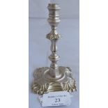 A silver George II taperstick, London 1751, maker Hugh Mills. Small heraldic insignia to base.