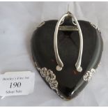 A pretty late Victorian silver mounted on tortoiseshell wishbone desk clip in a heart shape.