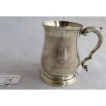 An C18th George II silver tankard with scroll decorated handle. London 1745, maker Fuller White.