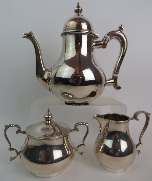 A good Garrard & Co silver three piece tea set in the Queen Anne style, London 1954-55, approx