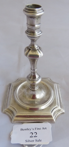 A silver George I taperstick on square base, London 1724, maker James Gould. Weight 116 grams,