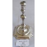A silver George I taperstick on square base, London 1724, maker James Gould. Weight 116 grams,