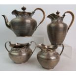 A Stylish Edwardian Arts & Crafts silver four piece tea set by Edward Barnard & Sons Ltd, London