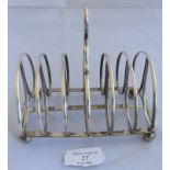 A large Georgian silver toast rack on ball feet, Sheffield 1824, maker John and Thomas Settle.