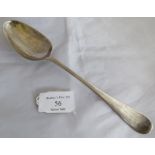 A silver George III tablespoon with shell to back of bowl. London 1767, maker WT. Weight 57 grams,
