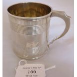 A William IV silver christening mug with reeded plain body and gilt interior, London 1832, maker W K