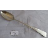 A George III silver basting spoon with engraved pattern handle having possibly a tiger motif and