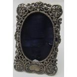 A Victorian silver frame with openwork decoration and five mask design faces, London 1884. Condition