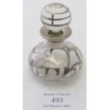 An overlayed white metal glass scent bottle with original stopper. Height 8cm including stopper. Max