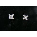 A pair of 18ct white gold princess cut diamond four claw stud earrings, diamonds approx 0.74cts,