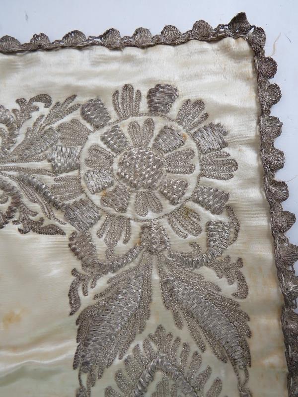 An antique finely worked silk panel with white metal thread possibly silver (80cm x42cm), plus a - Image 3 of 6