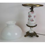 A hand decorated Limoges style continental oil lamp converted for electricity with gilt brass base