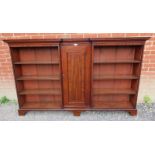 A Georgian mahogany reverse breakfront bookcase, inlaid and crossbanded, housing an array of eight