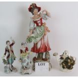 A large continental porcelain figure of a female, a similar pair of Sitzendorf porcelain figures and