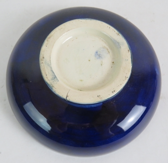 A small Moorcroft pottery dish with orchid decoration on a dark blue ground. Incised Moorcroft - Image 3 of 4