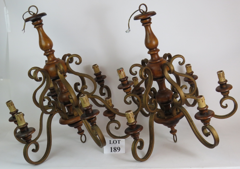 Two gilt metal and wood six branch electric chandeliers, height 70cm. (2). Condition report: Vintage