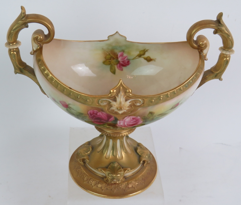 A 1920's Royal Worcester Blush hand decorated navette shaped pedestal urn painted with rose