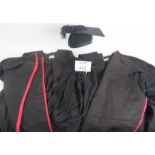 Two black graduation gowns and a mortar board size 6 5/8. (5). Condition report: No issues.