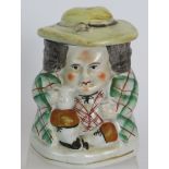 A 19th Century Staffordshire pottery Toby style tobacco jar. Height: 14cm. Condition report: