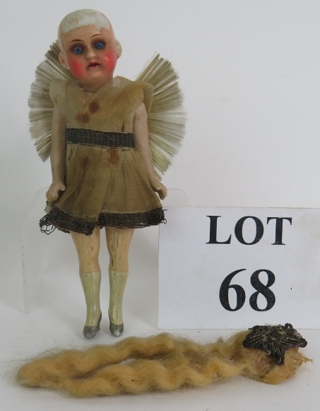 A small antique German porcelain headed doll by Armand Marseille in period angel dress with moveable