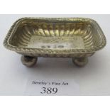 An antique Russian silver rectangular salt on ball feet with gilded interior, marked H.A, 83 and tow