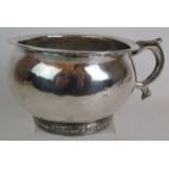 A 19th century Spanish Colonial South American white metal chamber pot with hammer planished bowl