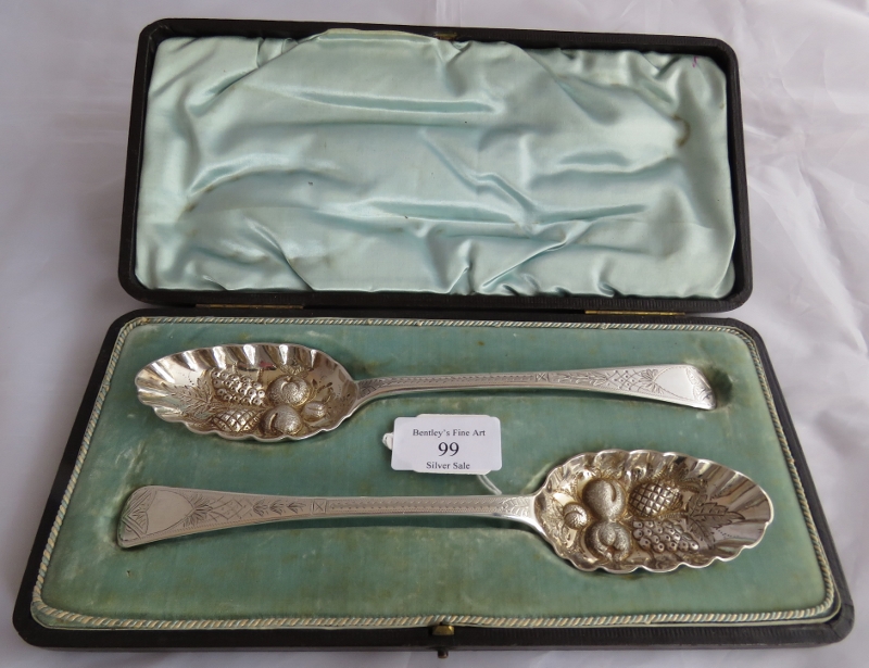 A boxed set of berry spoons with engraved decoration to handles. London 1808 and London 1815,