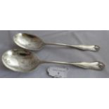 A Pair of silver Victorian serving spoons with foliate engraved bowls and reeded handle