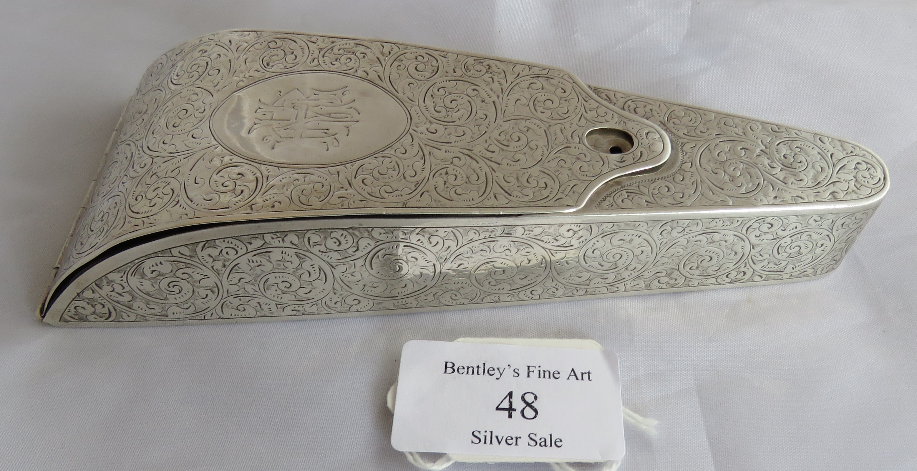 A lovely silver C19th engraved pattern scissor case containing 2 pairs of scissors (not silver).