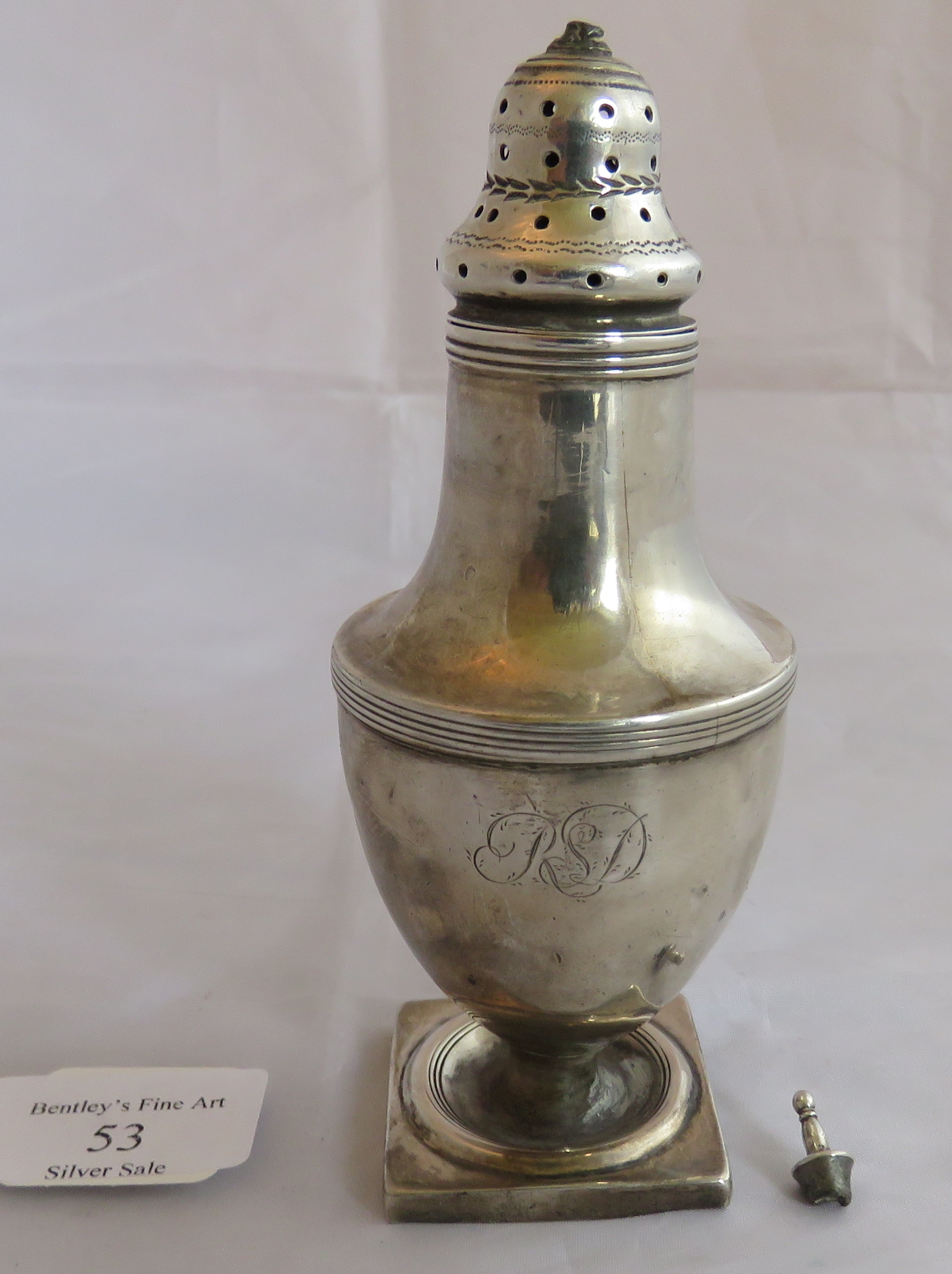 A Georgian silver sugar caster on square base, London 1800. Mono to front. Weight 100 grams,